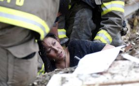 A woman is pulled out from under tornado debris at the Plaza Towers School in Moore, Okla., Monday, May 20, 2013. A tornado as much as a mile (1.6 kilometers) wide with winds up to 200 mph (320 kph) roared through the Oklahoma City suburbs Monday, flattening entire neighborhoods, setting buildings on fire and landing a direct blow on an elementary school. (AP Photo Sue Ogrocki)