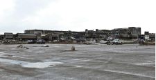 A shopping plaza lies in ruin after a huge tornado struck Moore, Oklahoma, near Oklahoma City, May 20, 2013. A massive tornado tore through the Oklahoma City suburb of Moore on Monday, killing at least 51 people as winds of up to 200 miles per hour (320 kph) flattened entire tracts of homes, two schools and a hospital, leaving a wake of tangled wreckage. REUTERS/Richard Rowe (UNITED STATES – Tags: DISASTER ENVIRONMENT