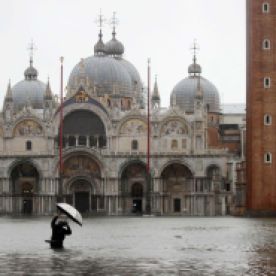 A person photographs a flooded St. Mark's Square on November 12.Luca Bruno/AP